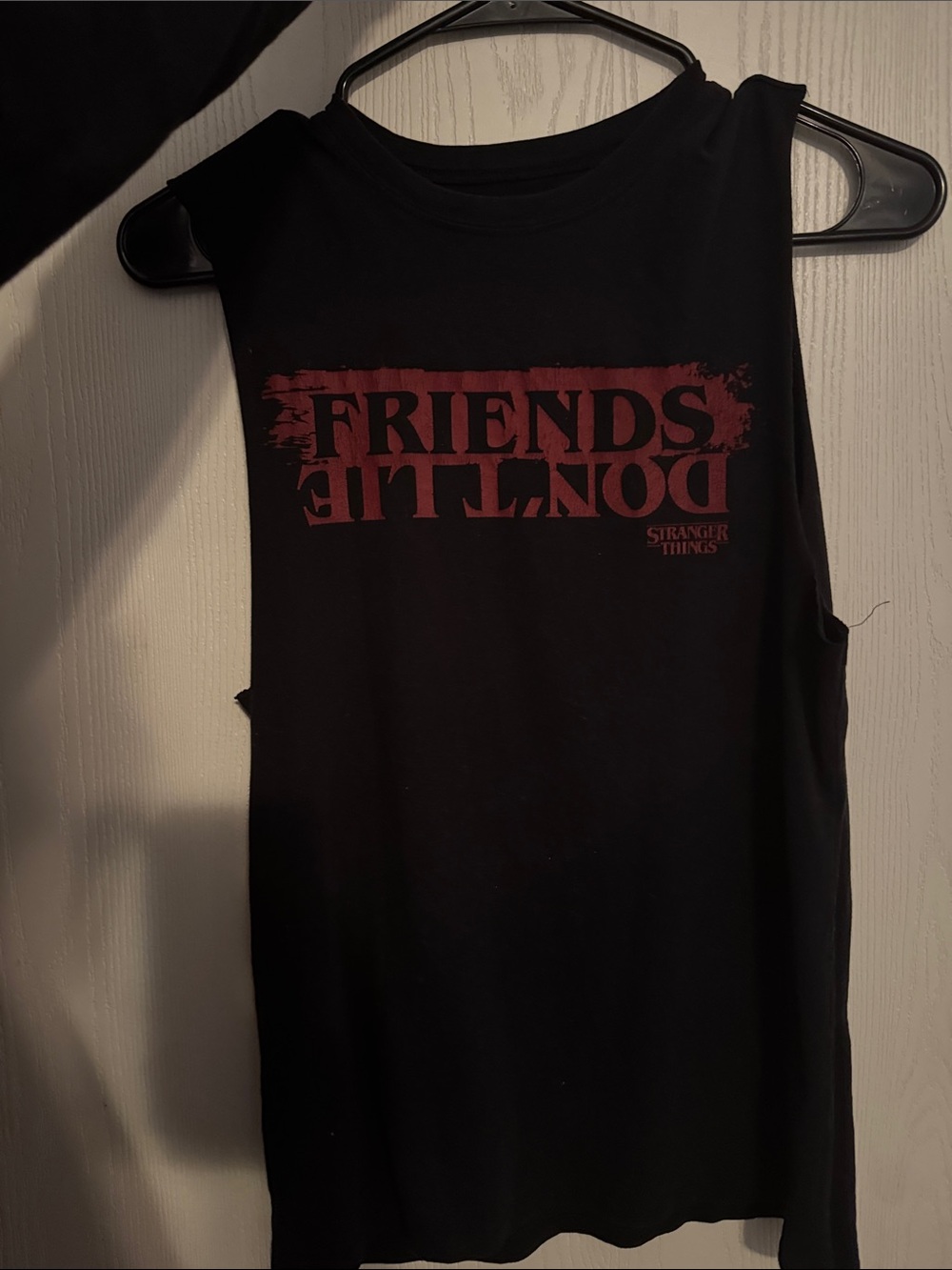 Netflix Black Tank Top with Red "Friends Don't Lie" Graphic